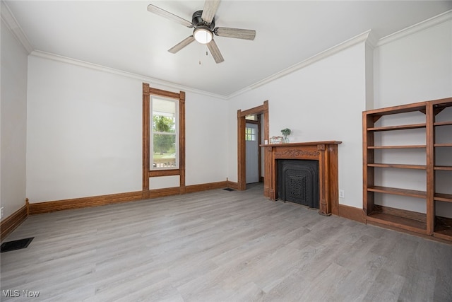 unfurnished living room featuring a fireplace, light wood-style floors, ornamental molding, and baseboards