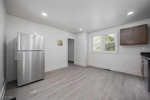 kitchen featuring freestanding refrigerator, dark brown cabinetry, light wood-type flooring, baseboards, and recessed lighting