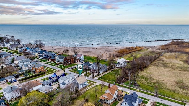 drone / aerial view featuring a residential view and a water view