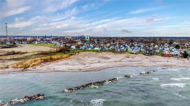 aerial view featuring a view of the beach, a residential view, and a water view