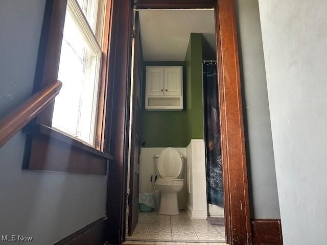 bathroom featuring tile patterned floors and toilet