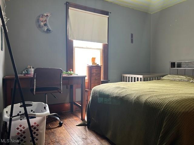 bedroom featuring wood-type flooring