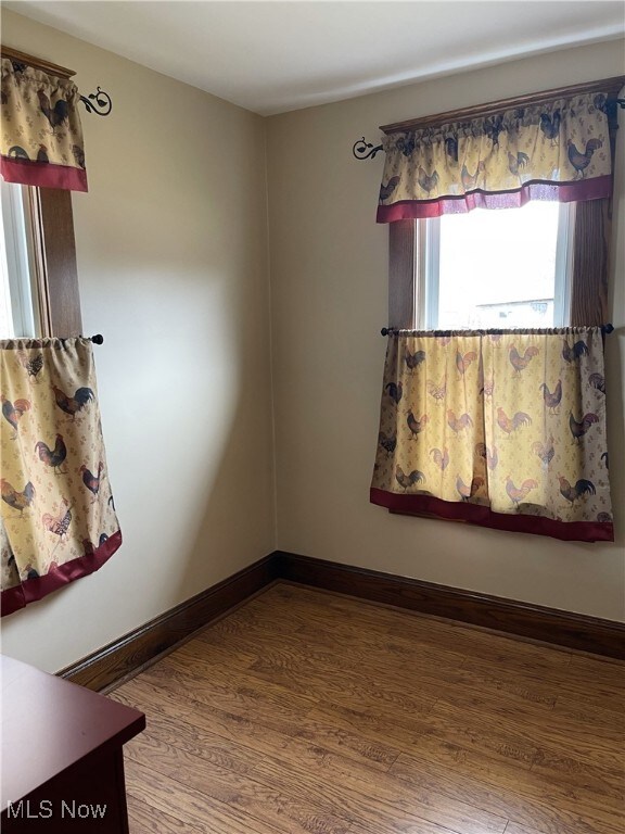 23314 Frostyville Rd, Caldwell, OH 43724 - empty room featuring baseboards and wood finished floors