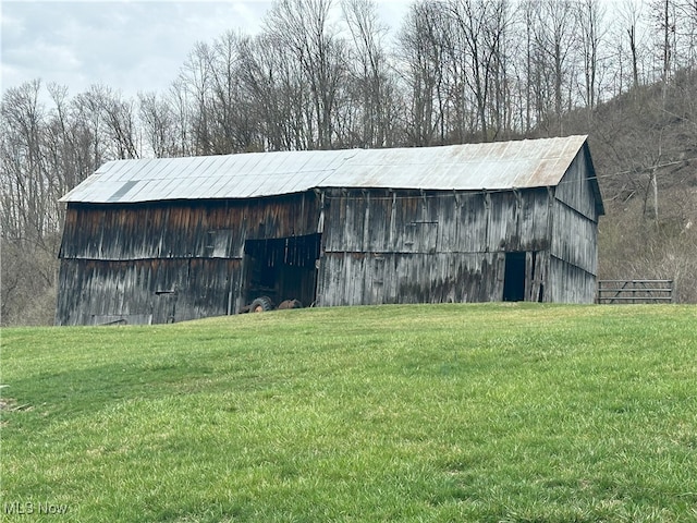 23314 Frostyville Rd, Caldwell, OH 43724 - view of barn with a yard