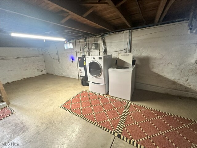 23314 Frostyville Rd, Caldwell, OH 43724 - below grade area featuring gas water heater and separate washer and dryer