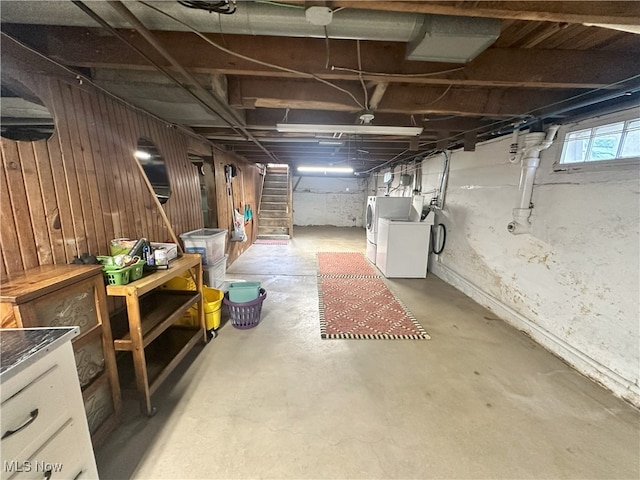23314 Frostyville Rd, Caldwell, OH 43724 - below grade area featuring stairs, washing machine and clothes dryer, and wood walls
