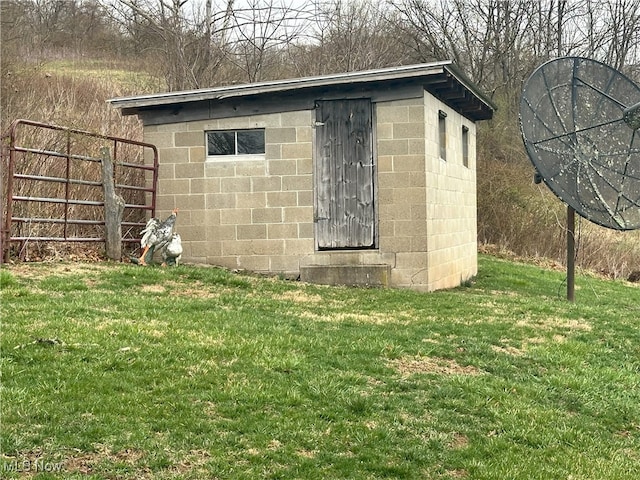 23314 Frostyville Rd, Caldwell, OH 43724 - view of side of property featuring a lawn and concrete block siding