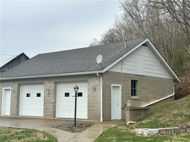 23314 Frostyville Rd, Caldwell, OH 43724 - view of front of home with concrete block siding and roof with shingles