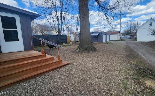 228 N 8th St, Coshocton, OH 43812 - view of yard featuring an outbuilding and fence