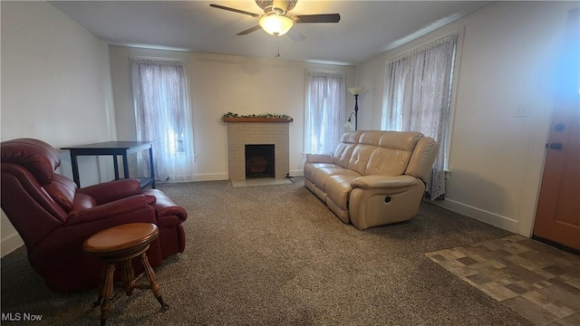 228 N 8th St, Coshocton, OH 43812 - carpeted living room with baseboards, a fireplace, and ceiling fan