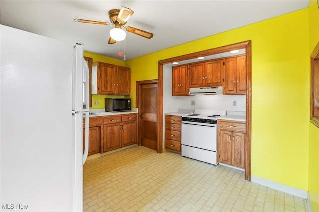 kitchen featuring light countertops, white appliances, ceiling fan, brown cabinets, and extractor fan