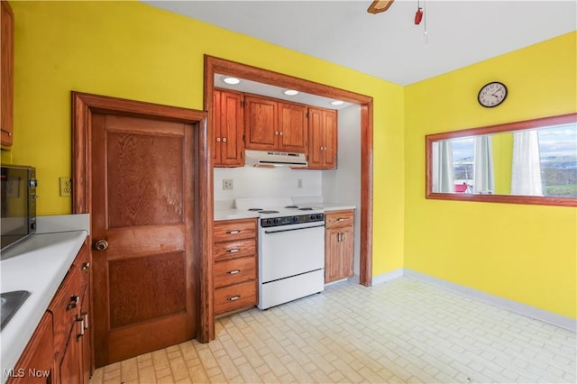 kitchen with light countertops, black microwave, white range with electric stovetop, exhaust hood, and ceiling fan