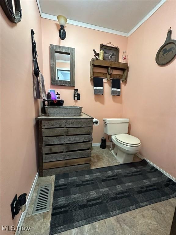 35955-35959 Bower Rd, Scio, OH 43988 - bathroom with visible vents, crown molding, baseboards, toilet, and vanity