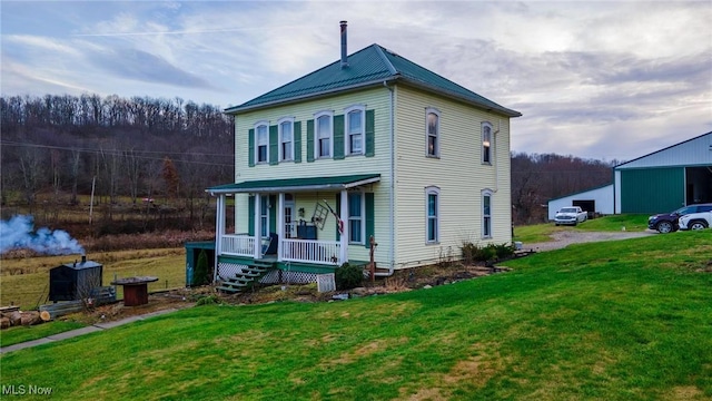 35955-35959 Bower Rd, Scio, OH 43988 - view of front of home featuring a porch, a forest view, metal roof, and a front lawn