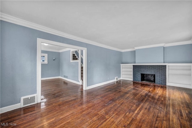 unfurnished living room with baseboards, visible vents, crown molding, and wood-type flooring