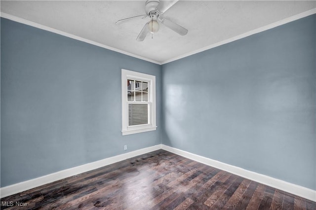unfurnished room featuring dark wood-style flooring, ornamental molding, baseboards, and ceiling fan