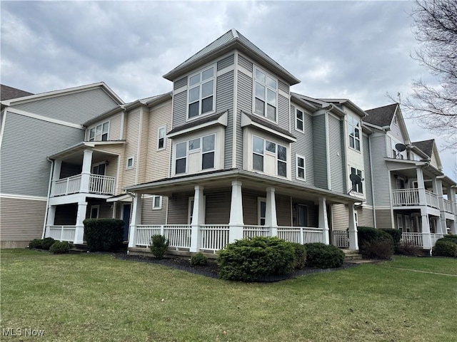 view of front of property with a front yard and a porch