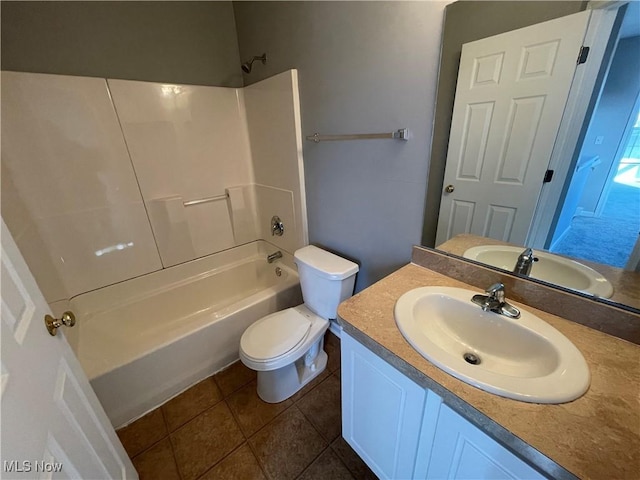 bathroom featuring tile patterned floors,  shower combination, vanity, and toilet