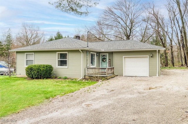 single story home with a chimney, a garage, a front lawn, roof with shingles, and driveway