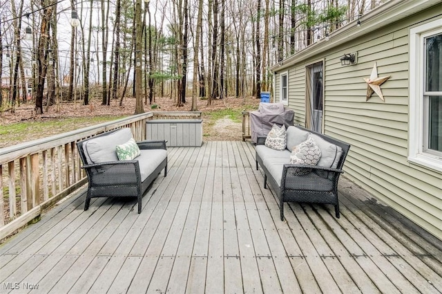 wooden terrace featuring an outdoor hangout area