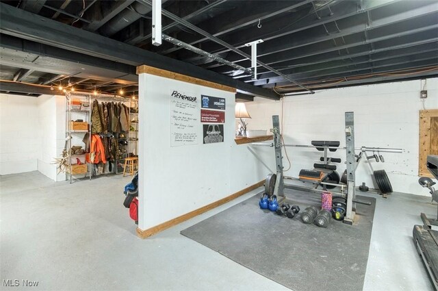 workout room featuring concrete block wall