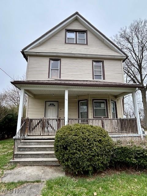 119 Erie St, Elyria, OH 44035 - view of front of home featuring covered porch