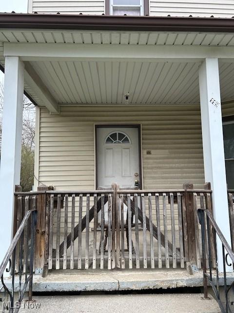 119 Erie St, Elyria, OH 44035 - doorway to property with covered porch