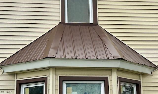 119 Erie St, Elyria, OH 44035 - exterior details featuring metal roof