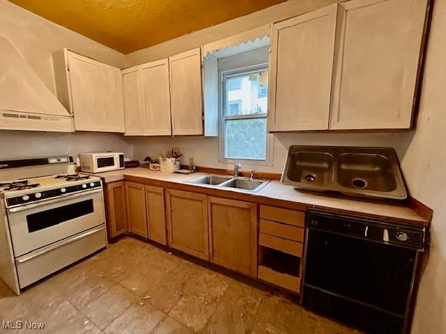 119 Erie St, Elyria, OH 44035 - kitchen with premium range hood, light countertops, a sink, and white appliances