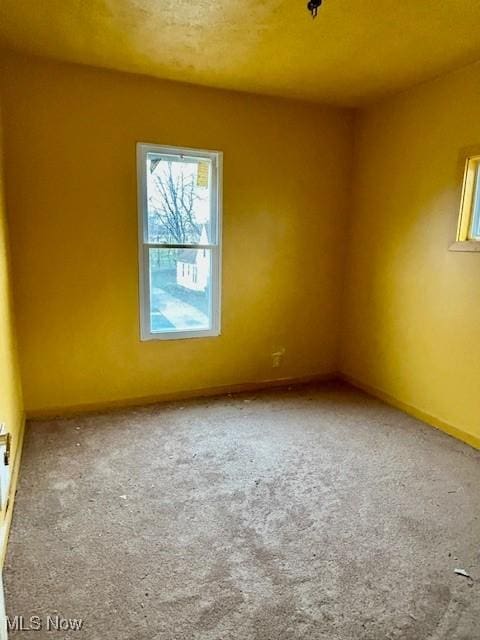 119 Erie St, Elyria, OH 44035 - empty room with baseboards and carpet flooring