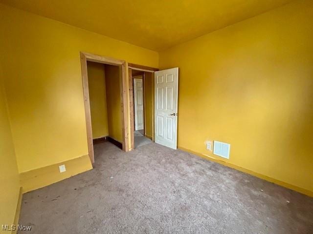 119 Erie St, Elyria, OH 44035 - unfurnished bedroom with carpet, baseboards, and visible vents