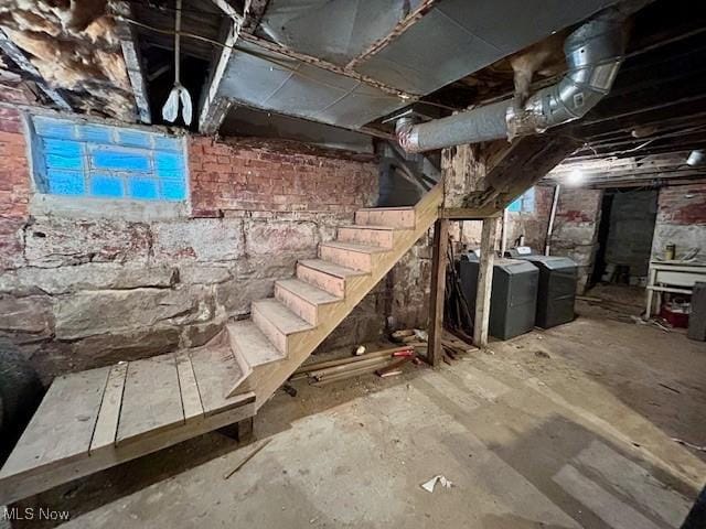 119 Erie St, Elyria, OH 44035 - unfinished below grade area with washer and clothes dryer and stairway