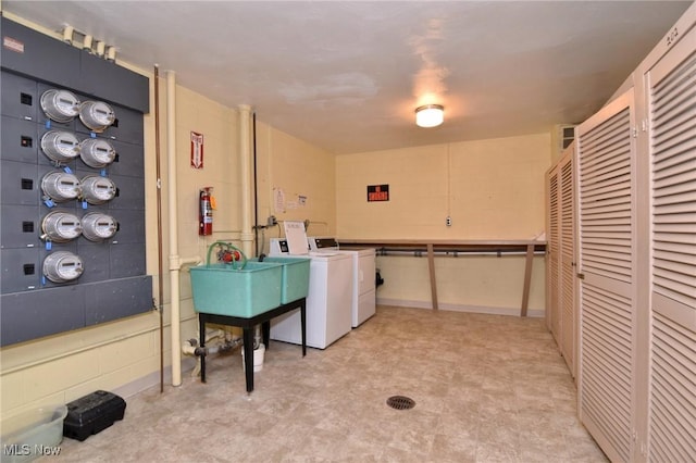 3333 Warrensville Center Rd Unit 204, Shaker Heights, OH 44122 - laundry area with separate washer and dryer, concrete block wall, light floors, and a sink