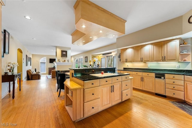 174 N Broad St, Canfield, OH 44406 - kitchen featuring light brown cabinets, arched walkways, open shelves, and light wood-style flooring