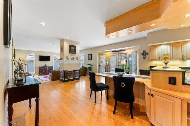 174 N Broad St, Canfield, OH 44406 - interior space with recessed lighting, light wood-style flooring, and a multi sided fireplace