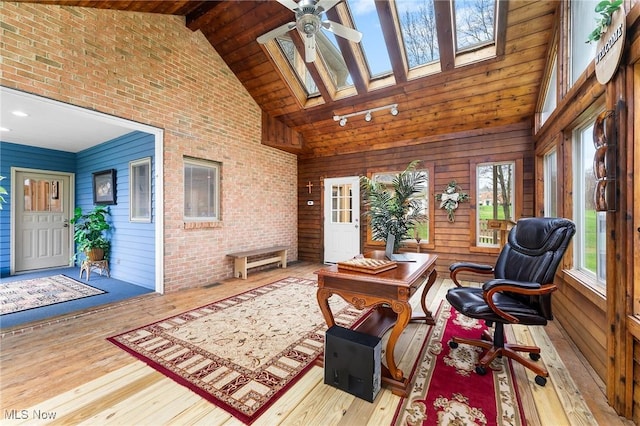 174 N Broad St, Canfield, OH 44406 - office space featuring high vaulted ceiling, a ceiling fan, hardwood / wood-style floors, and a skylight