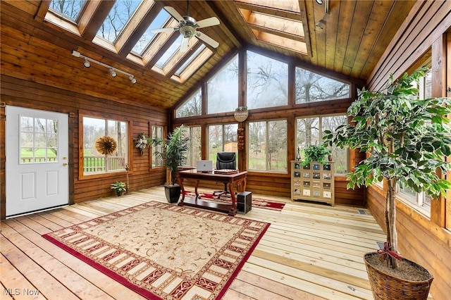 174 N Broad St, Canfield, OH 44406 - sunroom with plenty of natural light, vaulted ceiling with skylight, and a deck