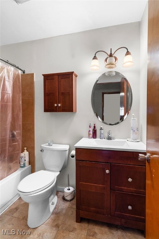 bathroom featuring toilet, shower / bath combo, and vanity
