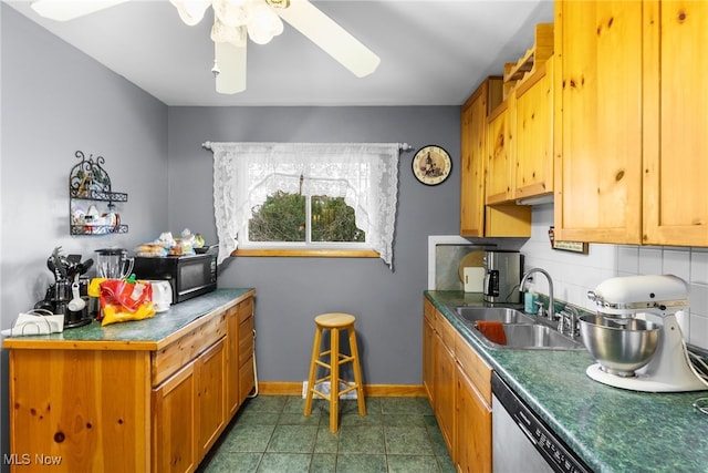 kitchen featuring black microwave, ceiling fan, tasteful backsplash, a sink, and dishwasher