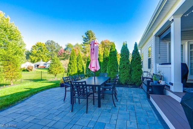129 Ava June Dr, Painesville Township, OH 44077 - view of patio / terrace with outdoor dining space and fence