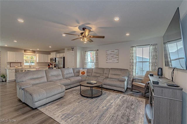 living room with recessed lighting, a ceiling fan, and wood finished floors