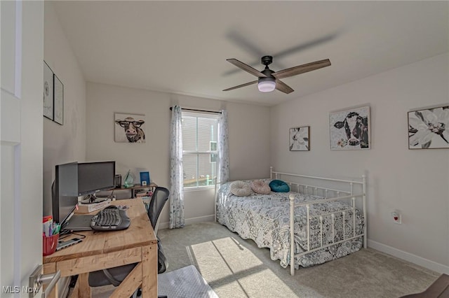 carpeted bedroom with ceiling fan and baseboards