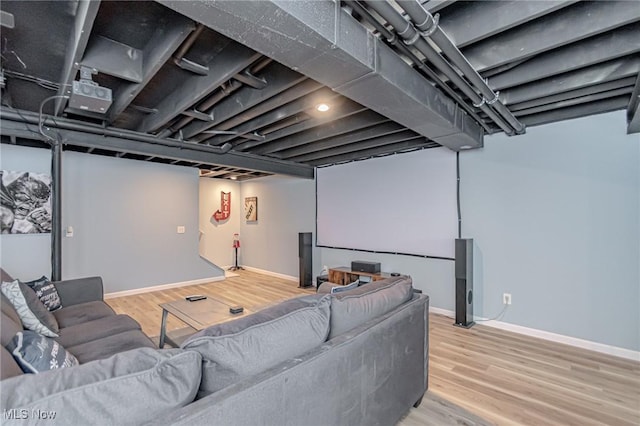 cinema room with wood finished floors and baseboards