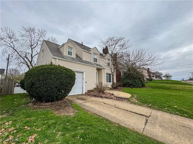 cape cod-style house with a front yard and concrete driveway