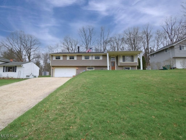bi-level home with an attached garage, a chimney, concrete driveway, and a front lawn