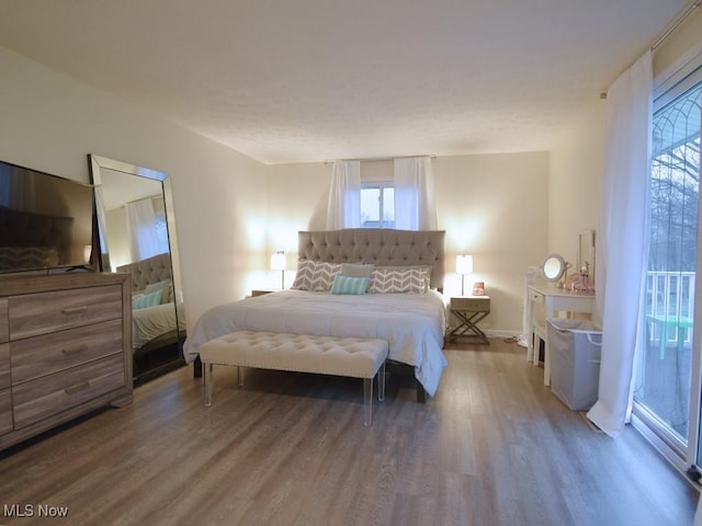 bedroom featuring wood finished floors