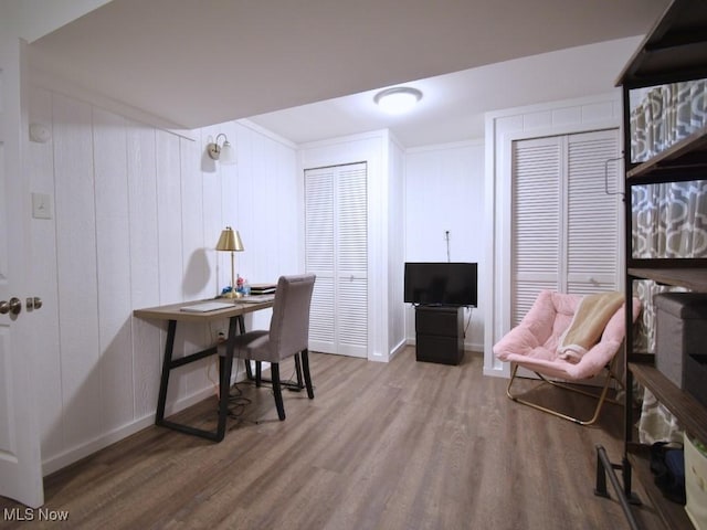home office featuring wood finished floors and baseboards