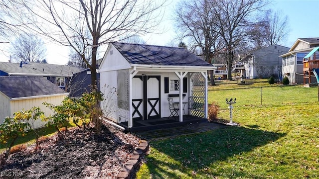 view of shed with fence