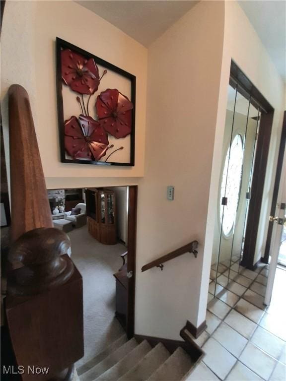 staircase with tile patterned flooring