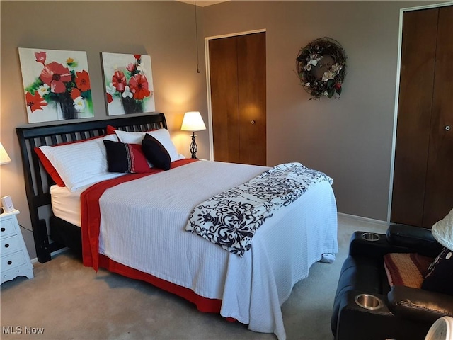 bedroom featuring baseboards and carpet floors